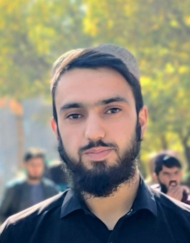 Profile picture of Elhamuddin Mayar, a confident young professional with short dark hair, wearing a smart casual blue shirt, smiling warmly